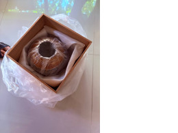 clay pot with a wooden box