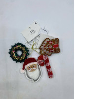 Set of 4 VINTERFINT Christmas ornaments from IKEA made from felt include a wreath, gingerbread house, Santa Claus and candy cane designs.