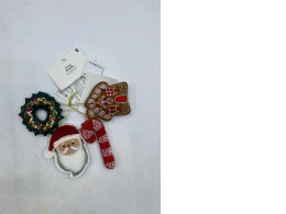 Set of 4 VINTERFINT Christmas ornaments from IKEA made from felt include a wreath, gingerbread house, Santa Claus and candy cane designs.