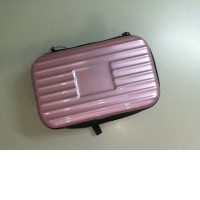 A small cosmetic bag in a suitcase