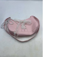  pink retro ballerina-style baguette shoulder bag with a lace bow and a pearl chain strap