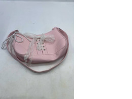 pink retro ballerina-style baguette shoulder bag with a lace bow and a pearl chain strap pink retro ballerina-style baguette shoulder bag with a lace bow and a pearl chain strap