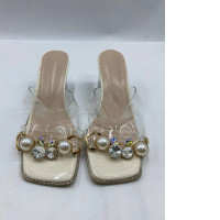Women's clear platform sandals decorated with faux pearls and crystals.