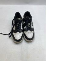 Black and white Nike Dunk Low Retro "Panda" sneakers.