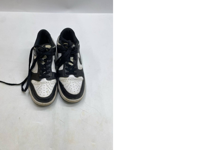 Black and white Nike Dunk Low Retro "Panda" sneakers. Black and white Nike Dunk Low Retro "Panda" sneakers.