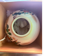 Ceramic pot with painted flowers and leaves, in a protective wooden box.