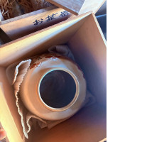 Ceramic pot with floral design in a wooden box