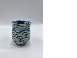 Large, tall, blue teacup with white patterns, Japanese.