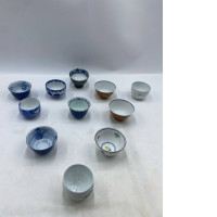 Set of 11 Japanese teacups with patterns. 