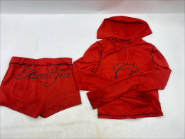red long-sleeved hooded shirt for women and red shorts.