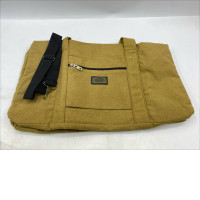 mustard yellow duffel bag made of a thick wool-like fabric. mustard yellow duffel bag made of a thick wool-like fabric.