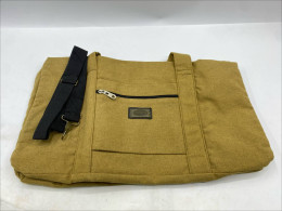 mustard yellow duffel bag made of a thick wool-like fabric. mustard yellow duffel bag made of a thick wool-like fabric.