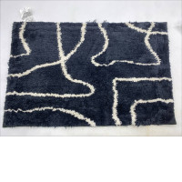 Black doormat with white stripes