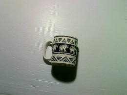 White ceramic mug with Thai elephant pattern