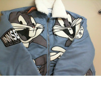 Blue fur-lined jacket with cartoon character embroidery