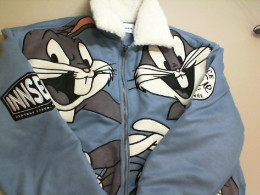 Blue fur-lined jacket with cartoon character embroidery
