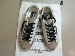 Second-hand sneakers + packing bag Second-hand sneakers + packing bag