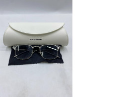 Women's eyeglasses in a white box.