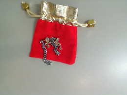 Set of earrings in a red gift bag