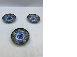 Set of 3 Antique Japanese Imairi-style glass plates feature intricate traditional patterns. Set of 3 Antique Japanese Imairi-style glass plates feature intricate traditional patterns.