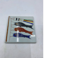 A glass plate decorated with carp (Koi nobori), a traditional Japanese decoration for Children's Day (Tango no Sekku).