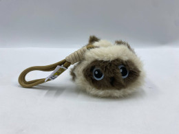 small, fluffy Siamese cat plush toy keychain. small, fluffy Siamese cat plush toy keychain.