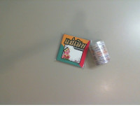 A set of notepads and tape with writing on them