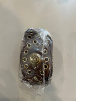  brown leather-look western-style belt with gold-tone metal eyelets and a decorative center buckle design. 