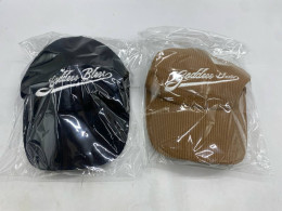 Set of 2  baseball caps with "Goddess Bless" embroidery in black and brown corduroy materials. 