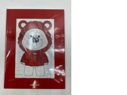 A teddy bear jigsaw puzzle from Moncler Enfant.