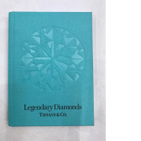 A booklet or catalog titled "Legendary Diamonds" from Tiffany & Co. would likely present information about the brand's historically significant and valuable diamonds, such as the famous Tiffany Diamond. A booklet or catalog titled "Legendary Diamonds" from Tiffany & Co. would likely present information about the brand's historically significant and valuable diamonds, such as the famous Tiffany Diamond.