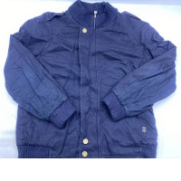 navy blue bomber jacket with rib-knit cuffs and hem, shoulder epaulettes, and gold-tone snap buttons.