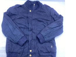 navy blue bomber jacket with rib-knit cuffs and hem, shoulder epaulettes, and gold-tone snap buttons.