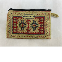  Moroccan-style fabric coin purse with a rug pattern and zipper closure. 