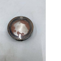 powder blush in a clear compact case.