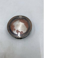 powder blush in a clear compact case.