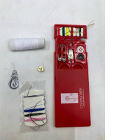 A portable red sewing kit for minor repairs.