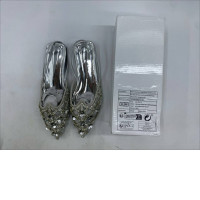 silver rhinestone-embellished ethnic flat shoes, possibly a type of Punjabi jutti or mojari. 