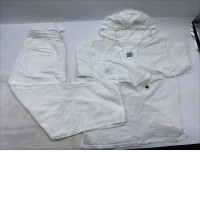 White trousers and a white long-sleeved hooded shirt.