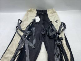 Adidas Ribbon Parachute Pants in Black. 