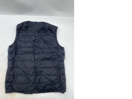 Muji lightweight pocketable collarless down vest in black. Muji lightweight pocketable collarless down vest in black.