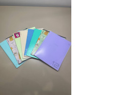 a set of eight notebooks