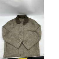The RWS faux fur jacket with ribbed collar from COS is available in greyish brown or beige.