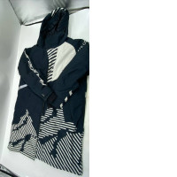 Insulated rain and cold weather ski coat, white and black.