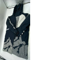 Insulated rain and cold weather ski coat, white and black.