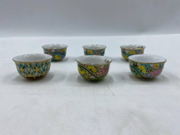 Set of 6 The Benjarong Chinese-style teacup features vibrant floral patterns on a yellow background, with a gold-plated rim.