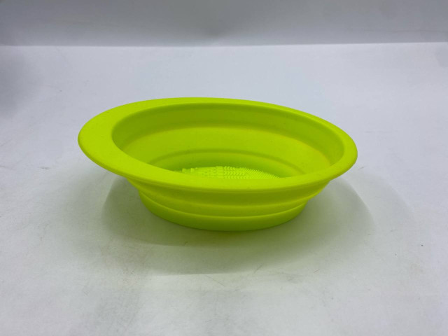 collapsible silicone travel bowl, likely for a pet. collapsible silicone travel bowl, likely for a pet.