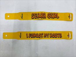 Set of 2 A yellow headband with the words "Beach Babe" in black, the text "SEABA GIRL" and "I FORGOT MY ROUTE", and the logos "Meteor" and "Seaba". 