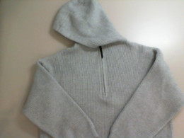 Knitted sweater with a zip-up hood