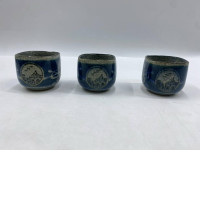 Set of 3 This is a Japanese-style glass tea or sake cup, glazed with a cracked blue and white finish and decorated with hand-painted landscape patterns.